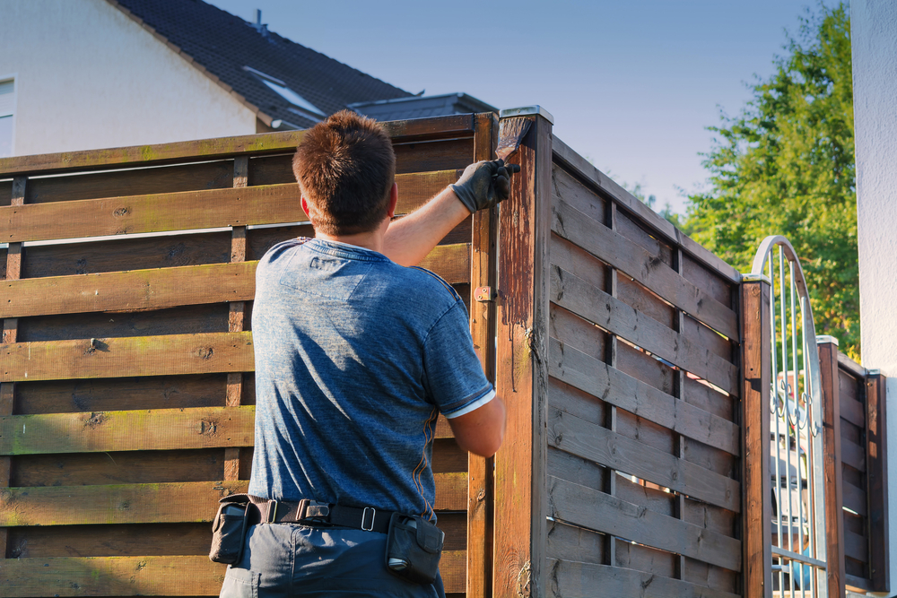 Stop the Gray: Why Professional Staining is the Secret to a Long-Lasting Fence