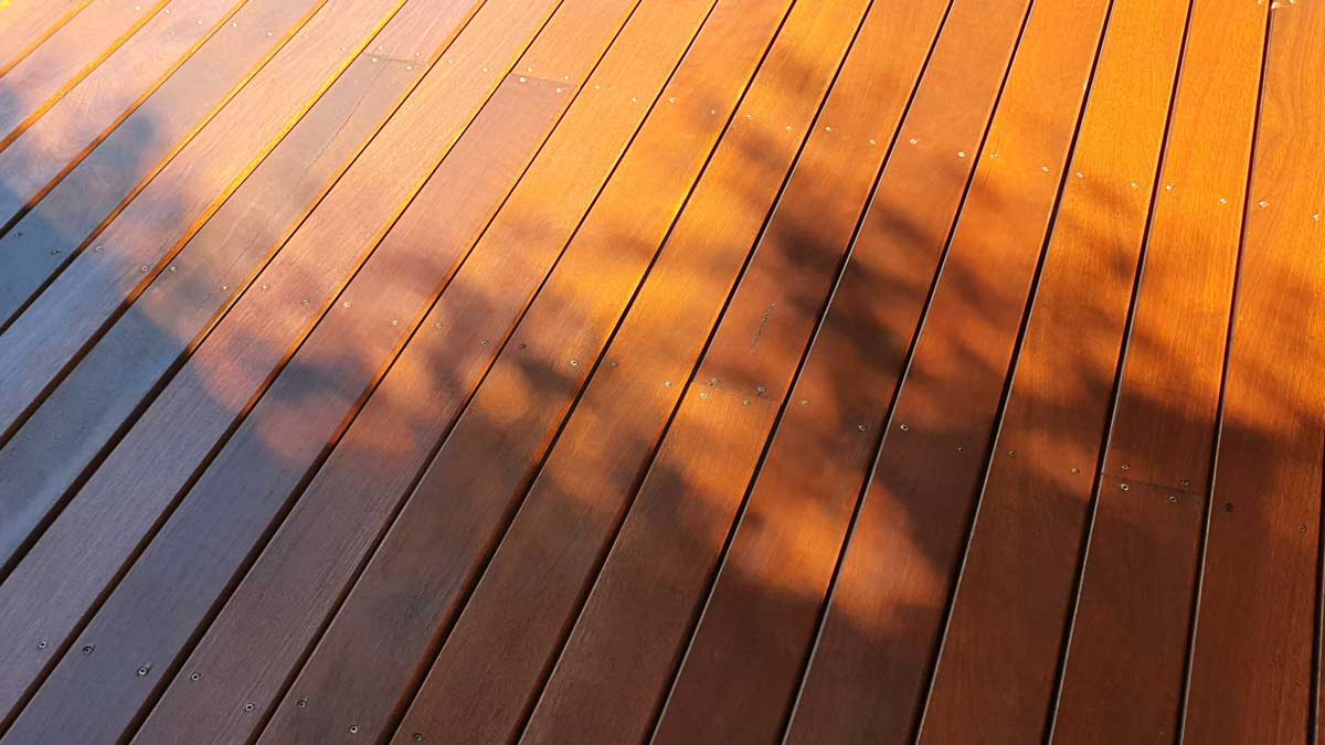 A bright, orange-brown deck half in shade